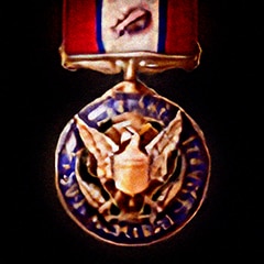 Distinguished Service Medal with an Oak Leaf Cluster