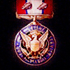 Distinguished Service Medal with two Oak Leaf Clusters